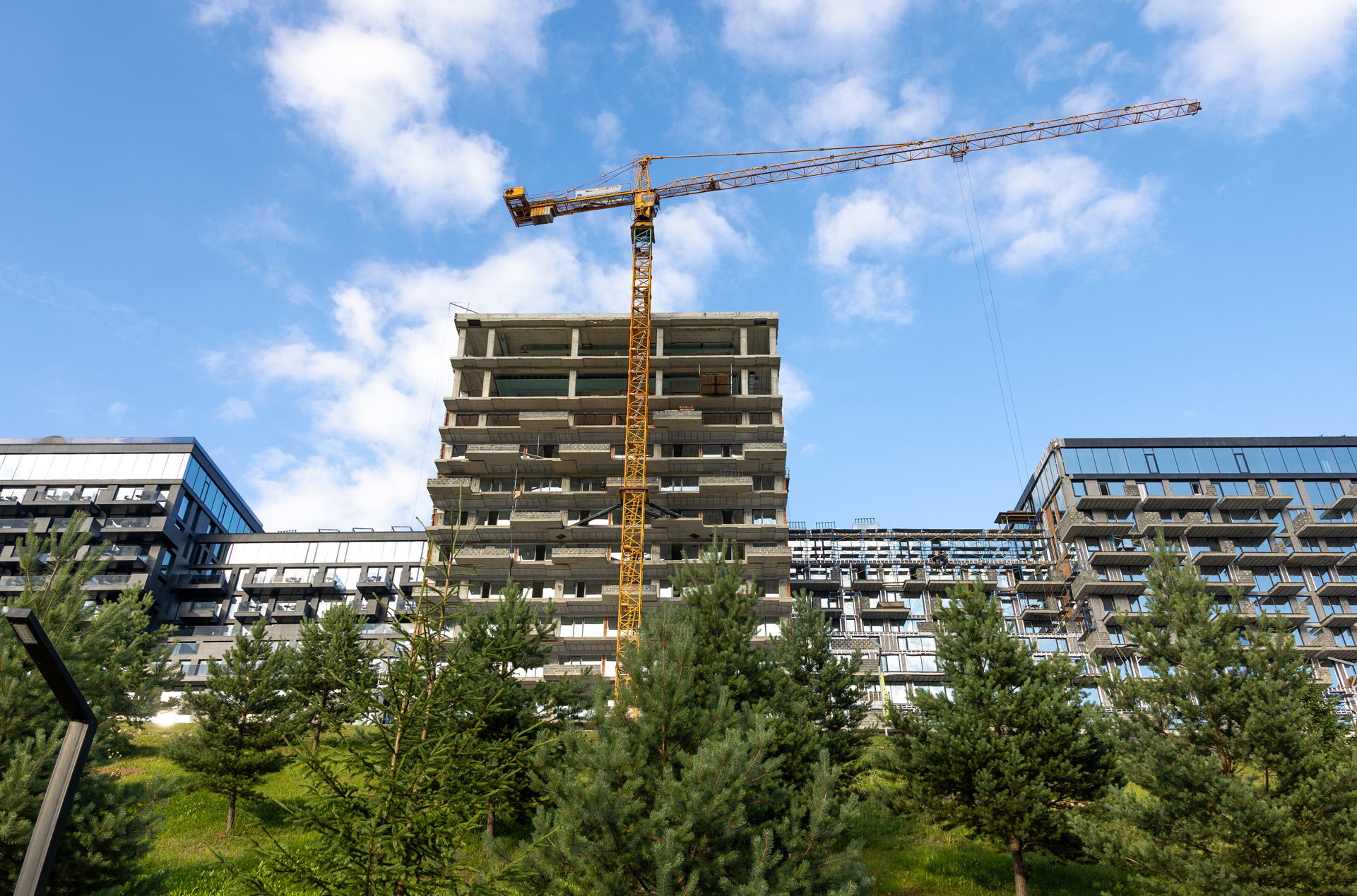 Construction site with cranes on sky background